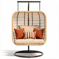 Hanging rattan chair with cushion and decorative pillows for indoor or outdoor use